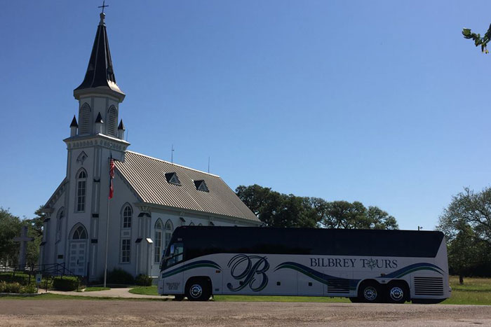 bus by an old church